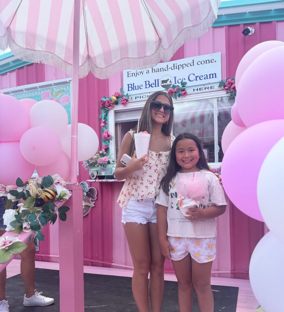 Guests holding a large flavored snowcone at Junie B’s